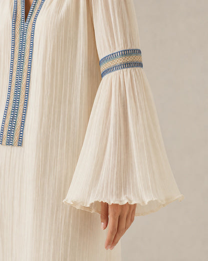 Ivory vintage blouse, embroidered bell-sleeve detail.