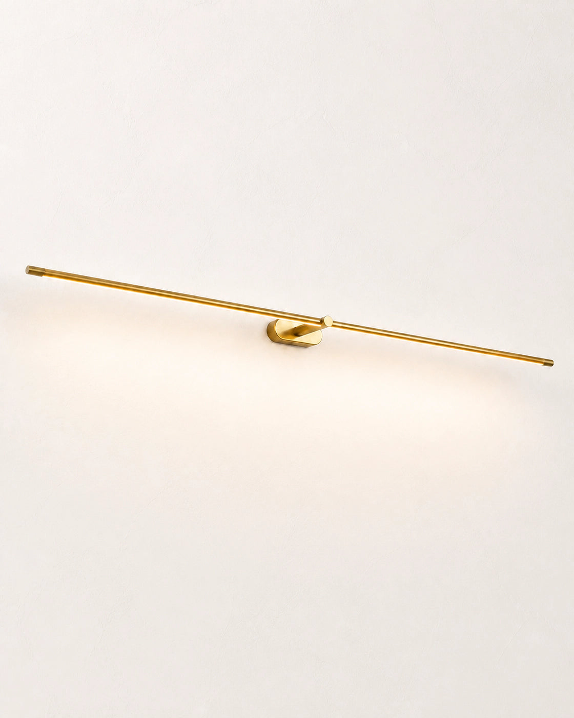 Gold Linear LED Wall Lamp on a bright off-white studio wall
