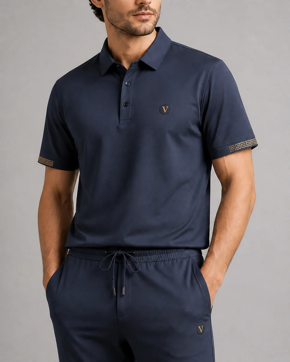 Blue men's polo and trousers set, collar waist and fabric detail.
