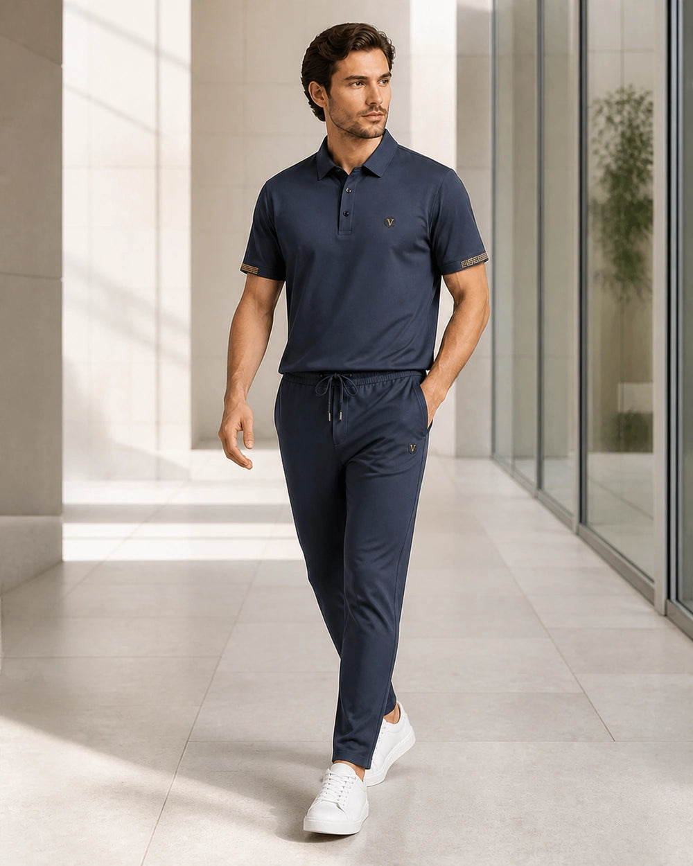 Blue men's polo and trousers set worn in movement.