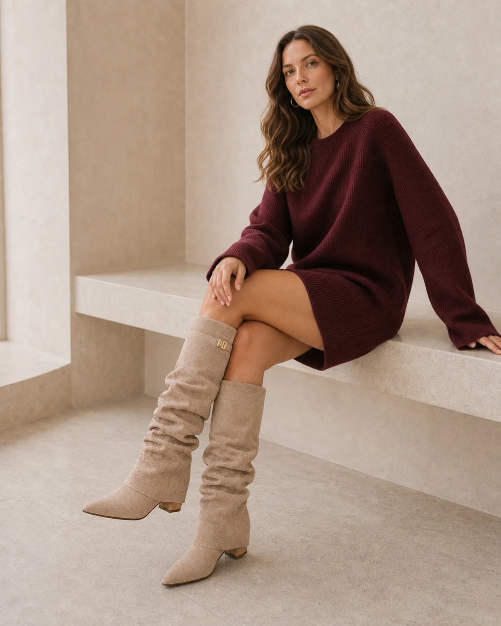 Women's light-brown ruched knee-high boots, seated styling.
