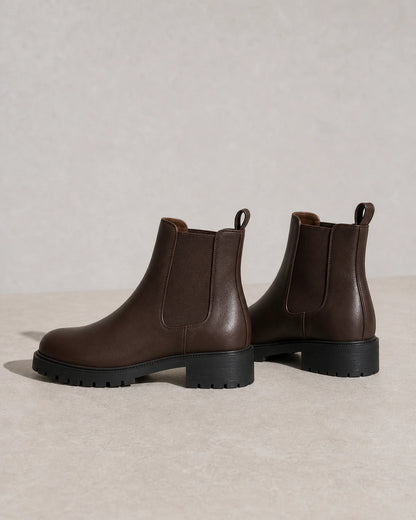 Women's chocolate brown lug-sole Chelsea boots, product-only view.